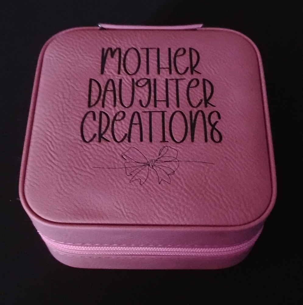 Pink Textured Cosmetic Bag with Decorative Design